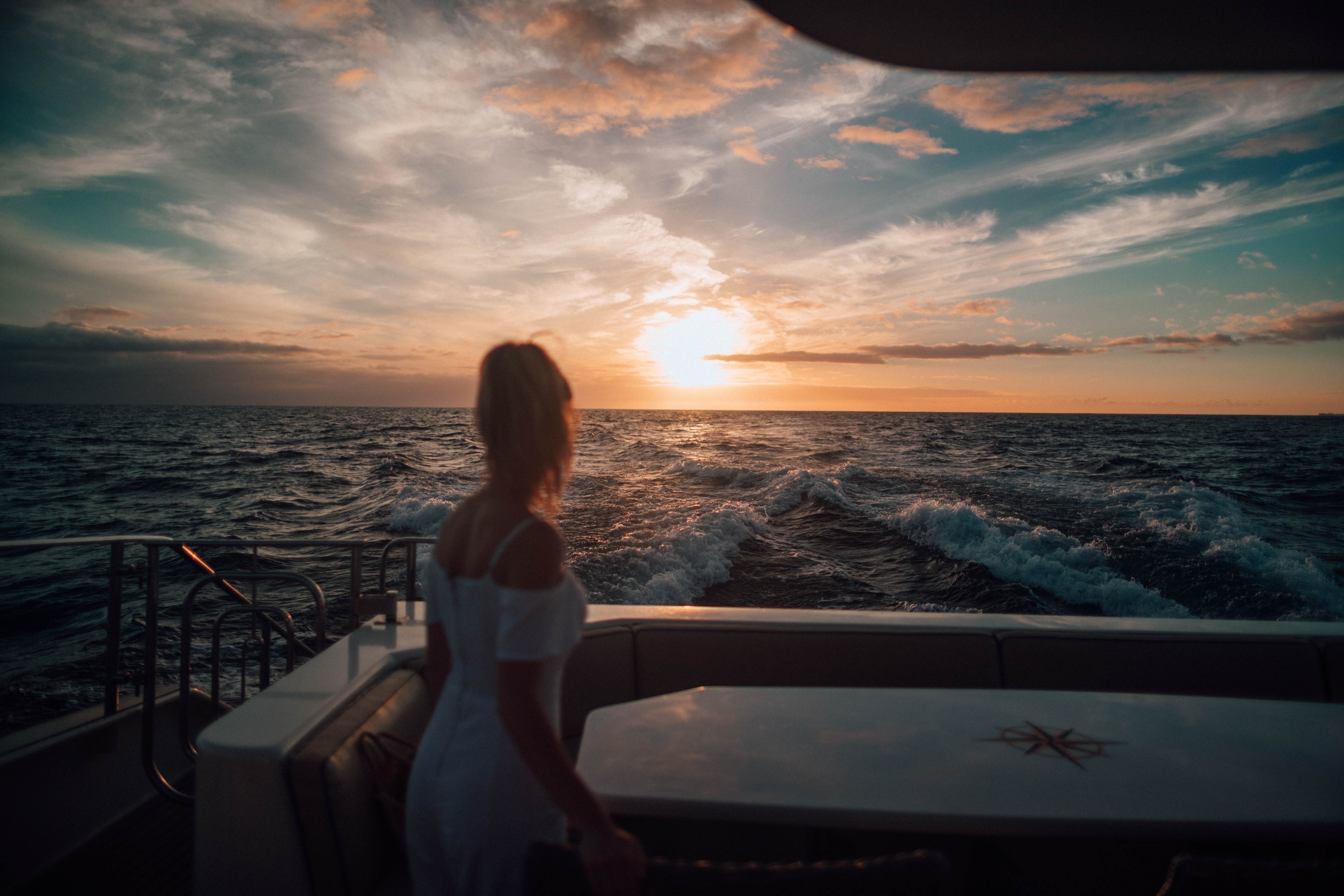 Watching the sunset from the stern of a yacht